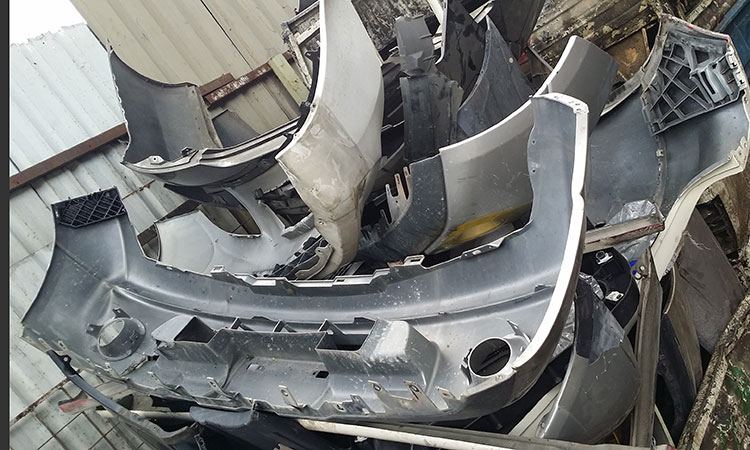 lump of broken car bumpers as automotive scrap