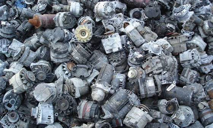 a pile of scrap electric motor parts for non-ferrous metal recycling
