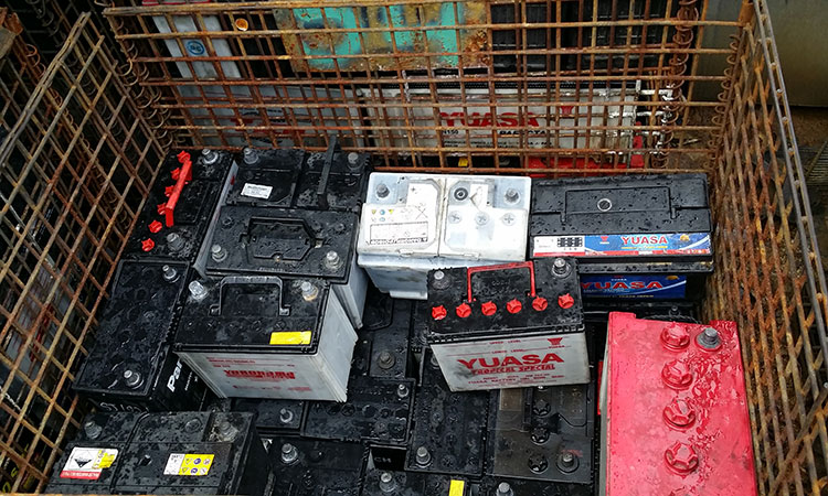 scrap car batteries stored and ready to go through non-ferrous metal recycling
